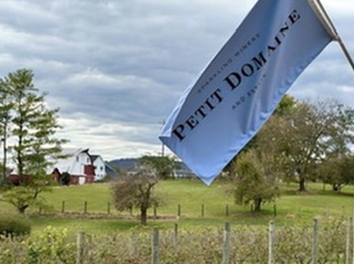 The Petit Domaine flag over the estate grounds