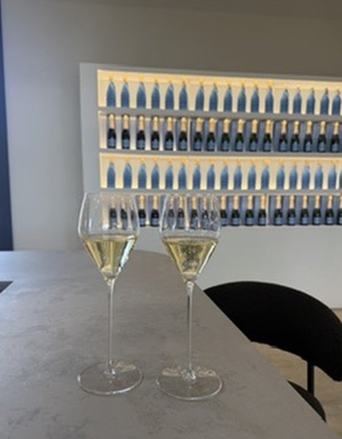 Two flutes of sparkling wine on the bar