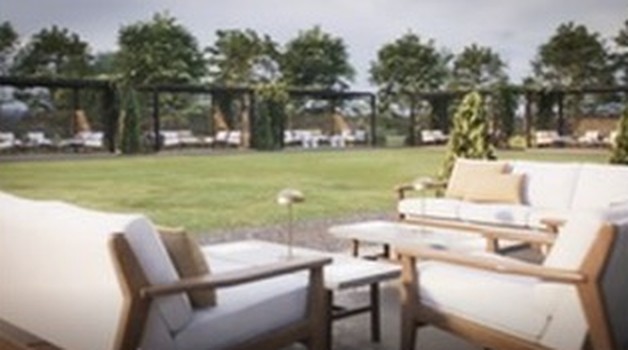 Shared courtyard pergolas with lounge sofas and armchairs facing the lawn